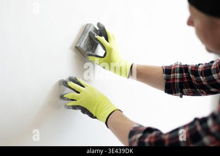 Sand Wall Putty And Prepare The Surface Before Painting Stock Photo