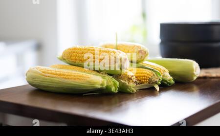 Fresh Raw Corn Cobs On A Kitchen Table For Boiling Stock Photo