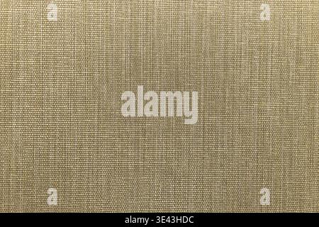 Close up of woven linen in neutral beige, showing natural fiber weave and rustic textile texture Stock Photo