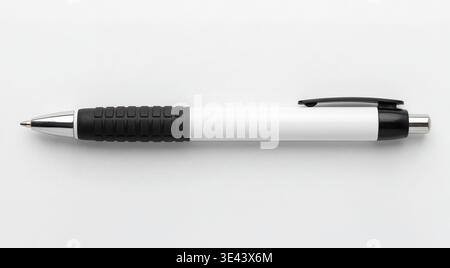 Mockup of a horizontal white and black ballpoint pen, isolated on a white background. Stock Photo