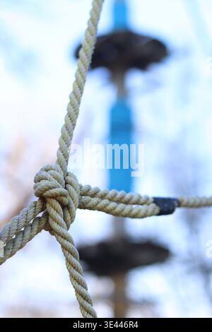 A complex knot of thick ropes, which is part of the structure of a rope ...