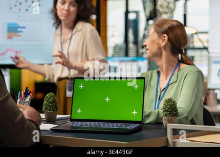 Diverse businesswomen using copy space mockup for performance indicators, setting company objectives with data insights. Corporate feminism and teamwork in work environment. Stock Photo