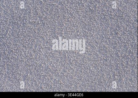 Grey stucco wall texture for graphic design. Rough grainy plaster surface with silver shadows as abstract background Stock Photo