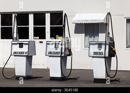 Vintage fuel pumps with unleaded petrol and diesel at rural service station, New Zealand Stock Photo