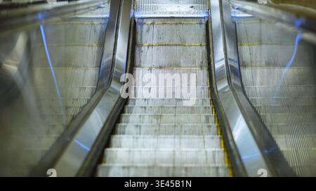 Moving escalator steps in Moscow Metro subway station providing public transportation Stock Photo