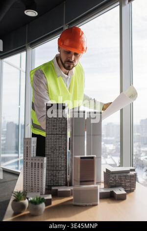 Architect Reviews Building Models Stock Photo