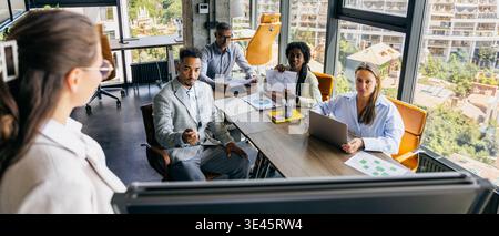 Creative team examines prototype with sketches and feedback discussions Stock Photo
