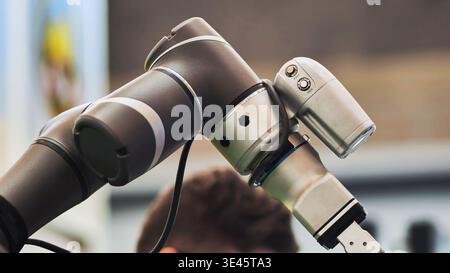 Collaborative industrial robot arm performing automated tasks in modern factory Stock Photo