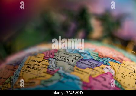 Close-up on a light-up globe displaying iran, afghanistan, and saudi arabia Stock Photo