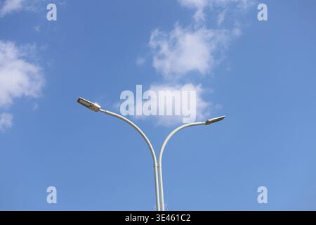 street lamp against blue sky Stock Photo