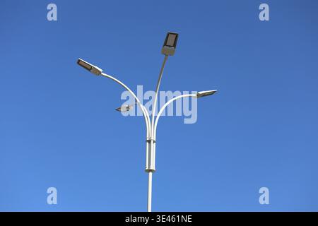 street lamp against blue sky Stock Photo