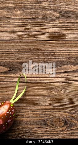 Decorative Easter egg on rustic wooden background vertical story template copy space Stock Photo