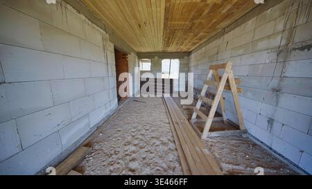 Unfinished room in a slavic village house showing building materials Stock Photo