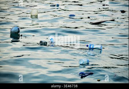 Empty Plastic bottles floating in the ocean. Concept plastic pollution. Maldives Islands, Asia Stock Photo