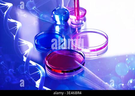Laboratory glassware, molecules and DNA strands, color toned. Research in biochemistry and genetics Stock Photo