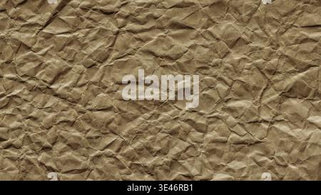 Crumpled brown kraft paper texture with natural wrinkles for eco-friendly background design Stock Photo
