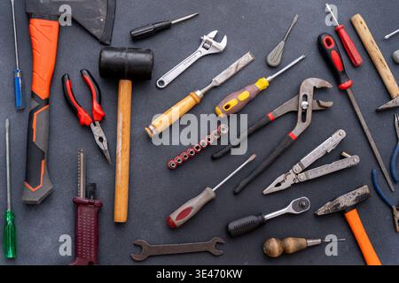 Different set hand tools top view hammers screwdrivers pliers, wrenches and clamps. DIY repair background. Stock Photo