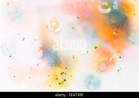 Creative abstract watercolor in water wallpaper with colorful liquid drops and copy space Stock Photo