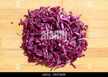 finely chopped red cabbage on the chopping board Stock Photo