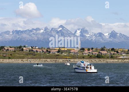 Pleasure boats in the harbour area, and the mountains of Patagonia beyond. Ushuaia, Argentina Stock Photo
