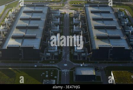 Aerial view of data center complex showcasing symmetrical architecture and infrastructure from an aerial perspective, symbolizing global connectivity, Stock Photo