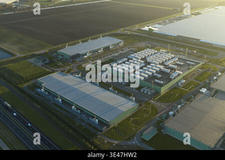 Aerial view of large interconnected ai data center complex with multiple buildings and storage units, handling internet and cloud computing operations Stock Photo