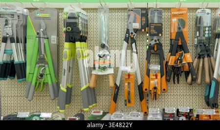 Burgas, Bulgaria - March 24, 2026: Various gardening tools such as pruners, shears, and loppers are neatly arranged on a pegboard in a retail environm Stock Photo