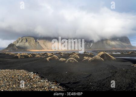 Iceland Stokksness at morning light with big cloud on hill Stock Photo