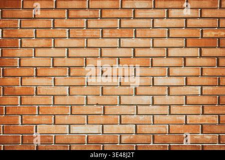 Orange brick wall texture. Sunlit brickwork. Grunge urban background Stock Photo