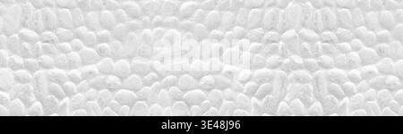 Whitewashed stone wall wide panoramic texture. White painted stones panorama. Long light background Stock Photo