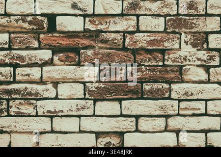 Old painted brick wall texture. Aged brickwork. Retro style grunge background Stock Photo