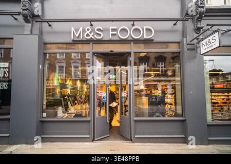 LONDON - FEBRUARY 26, 2026: M&S Food convenience store and supermarket entrance on Queensway Bayswater Stock Photo