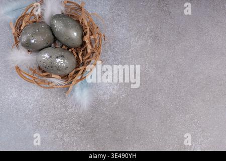 Minimal Easter greeting card eggs nest composition Stock Photo