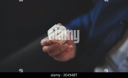 Man in a suit holding a box with two wedding rings. Stock Photo