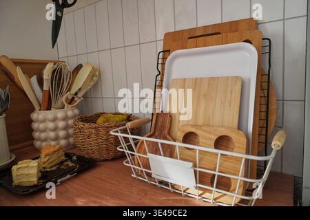 Stylish Kitchen Utensils and Wooden Cutting Boards Organized on a Modern Countertop Space Stock Photo