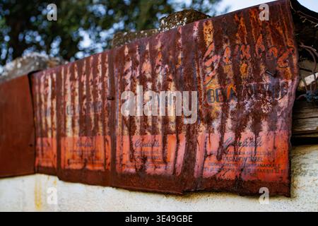 Rusty corrugated metal roofing made from repurposed oil cans in rural Turkey, Gallipoli Peninsula Stock Photo