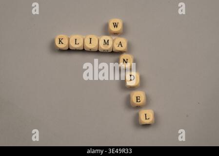 Cubes with letters form the word climate change, light background, top view, studio shot, Germany Stock Photo
