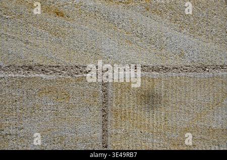 Sandstone wall showing natural patterns and rough granular surface Stock Photo