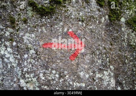 Red arrow on granite stone as texture or background Stock Photo