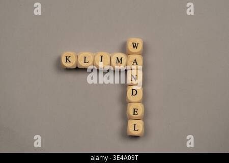 Cubes with letters form the word climate change, light background, top view, studio shot, Germany Stock Photo