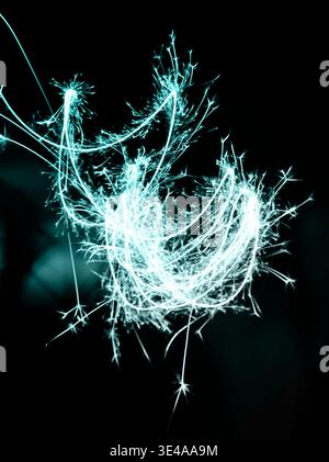 Abstract Glowing Turquoise Light Sparks Long Exposure Background Stock Photo