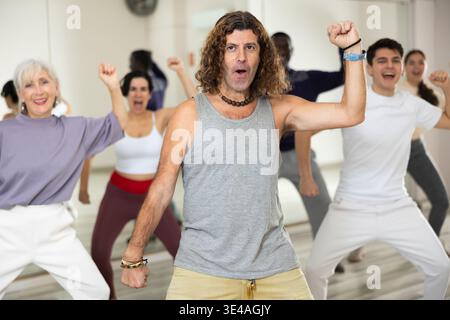 Group of multinational people practicing new modern dance techniques Stock Photo