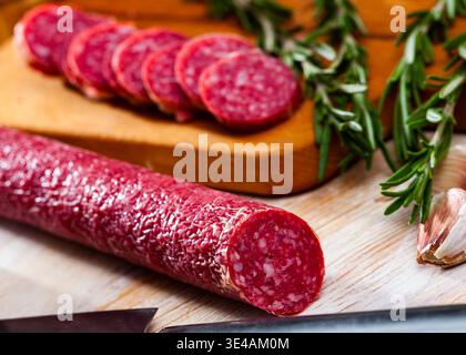 Sliced dry cured pork sausage Fuet Nobleza Stock Photo