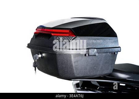 A red motorcycle with black side case, engine, seat, mirror, and rear ...