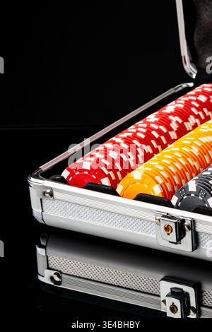 Poker chips are organized in a case ready for a game night with friends Stock Photo