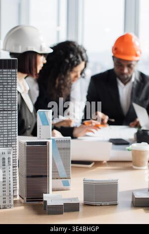 Architects Discussing Building Models Stock Photo