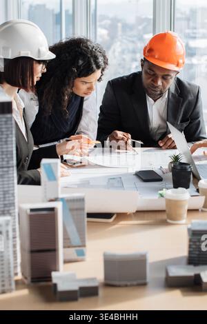 Architects Discussing Blueprints Stock Photo