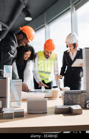 Architects Discussing Building Models Stock Photo