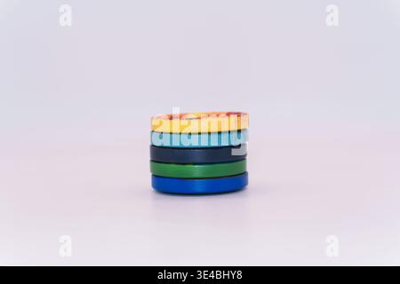 Macro photo of clothing buttons, a stack of multi-colored buttons on a white background. High quality Stock Photo