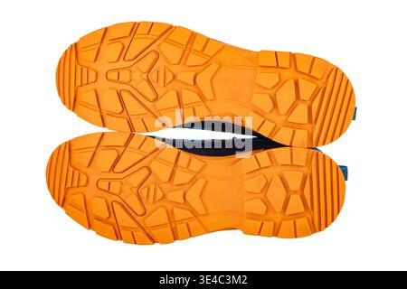 Orange Rubber Sneaker Soles  With Boots Tread Pattern, Sports hiking and trekking shoes isolated on white background Stock Photo